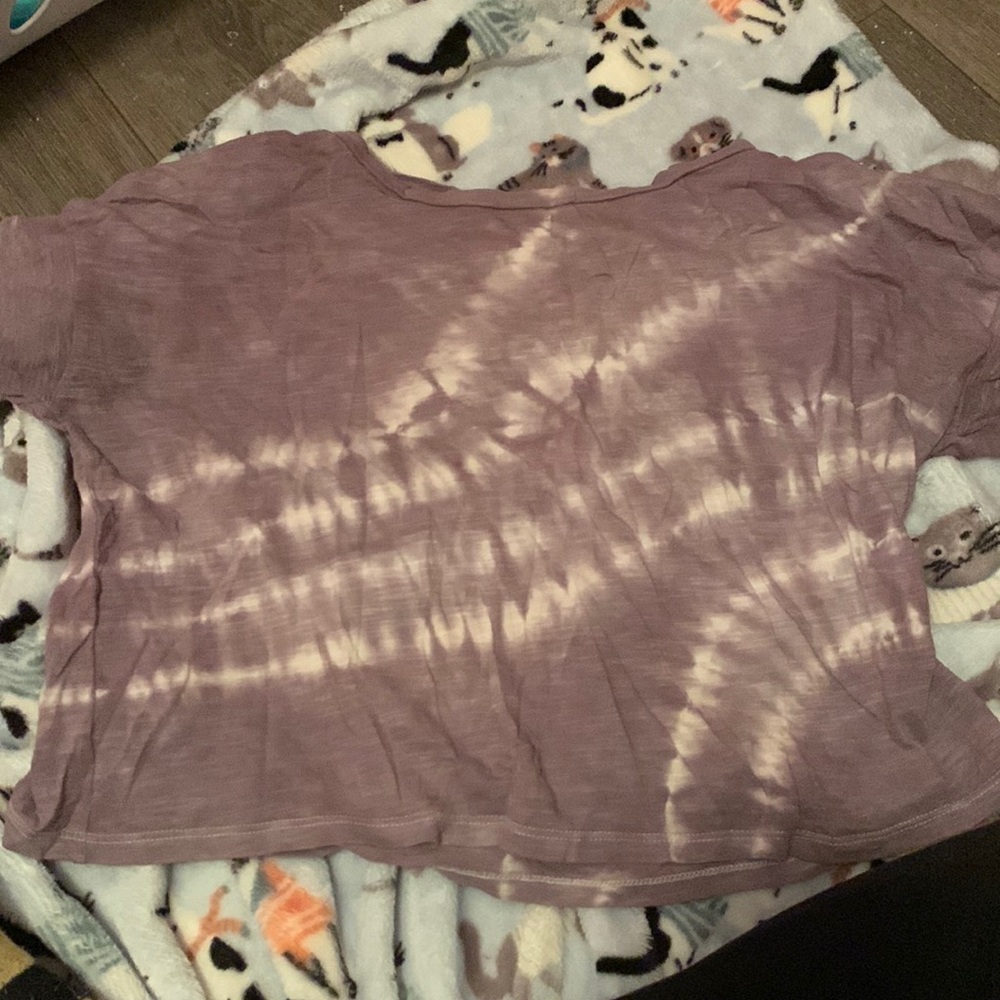 It’s purple and white. It’s from American Eagle and it’s a x-small
